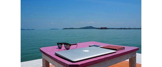 laptop with ocean in background